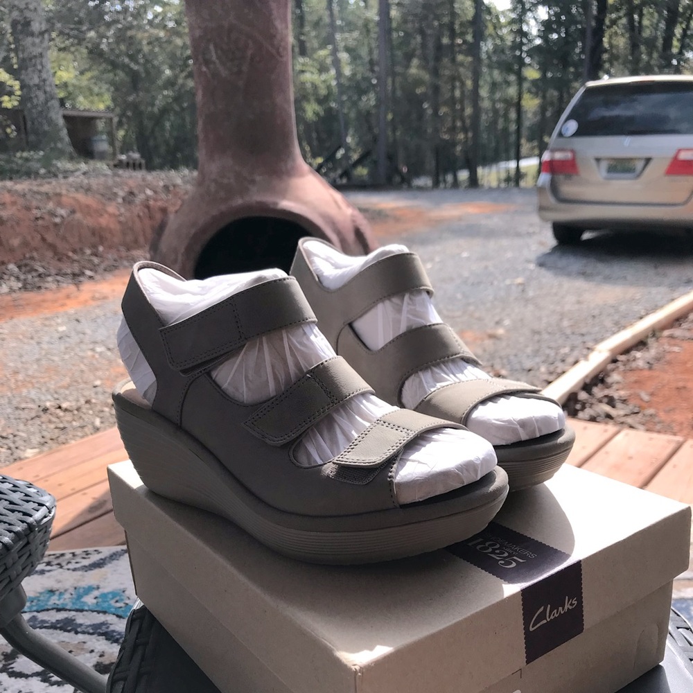 Clarks size 8 wedge triple strap sandal. Brand new in box.
